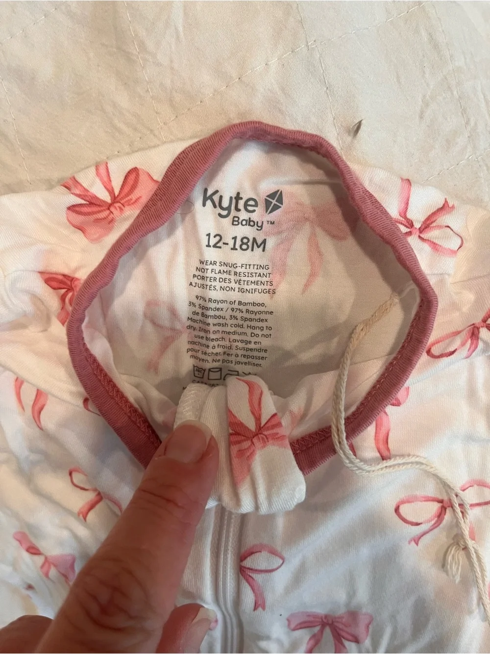 Kyte BABY White Footed One-Piece with Pink Bow Print